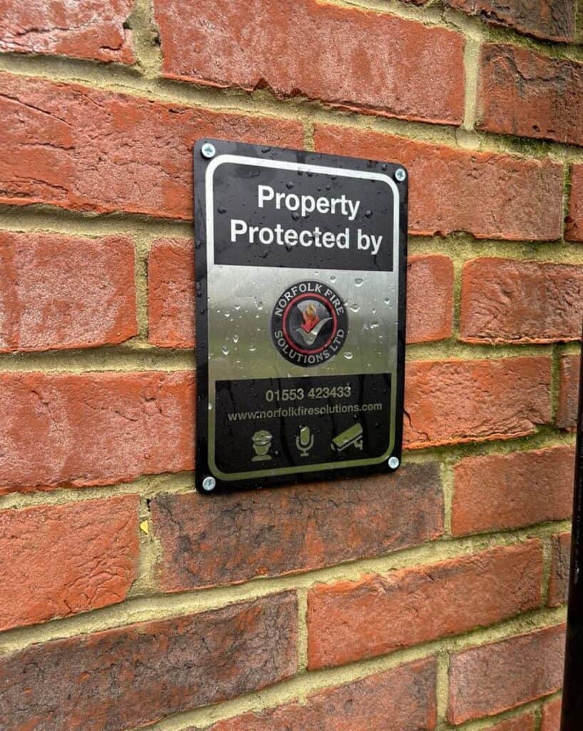 Fire protection sign on brick wall