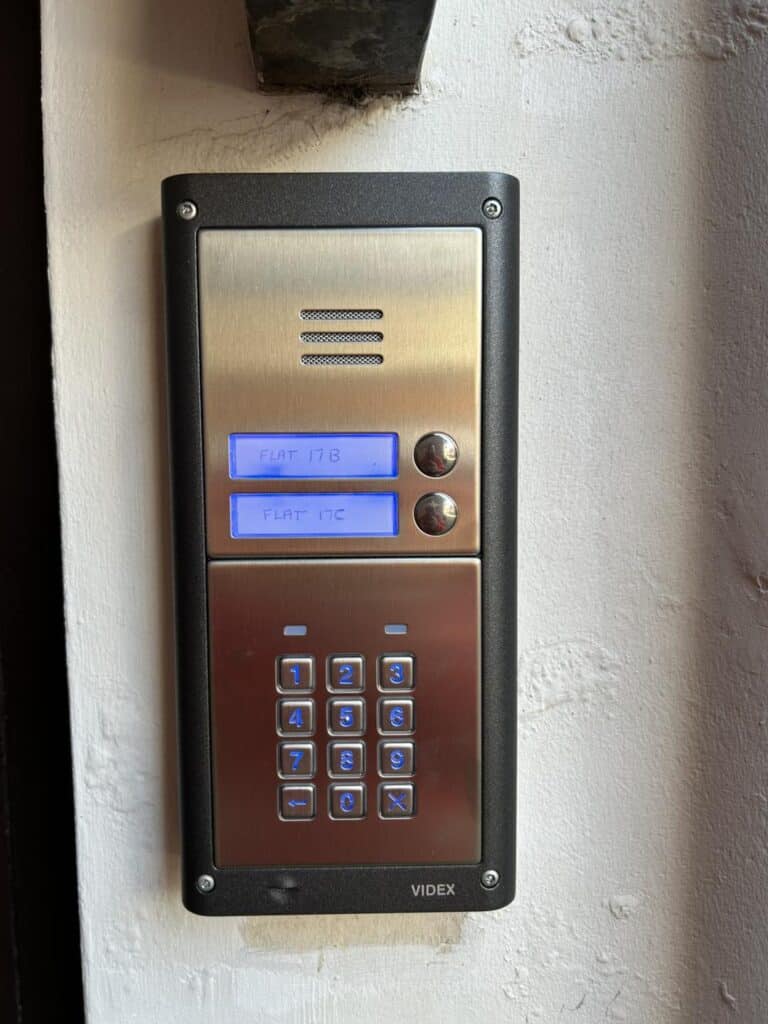 Close-up of a keypad intercom system