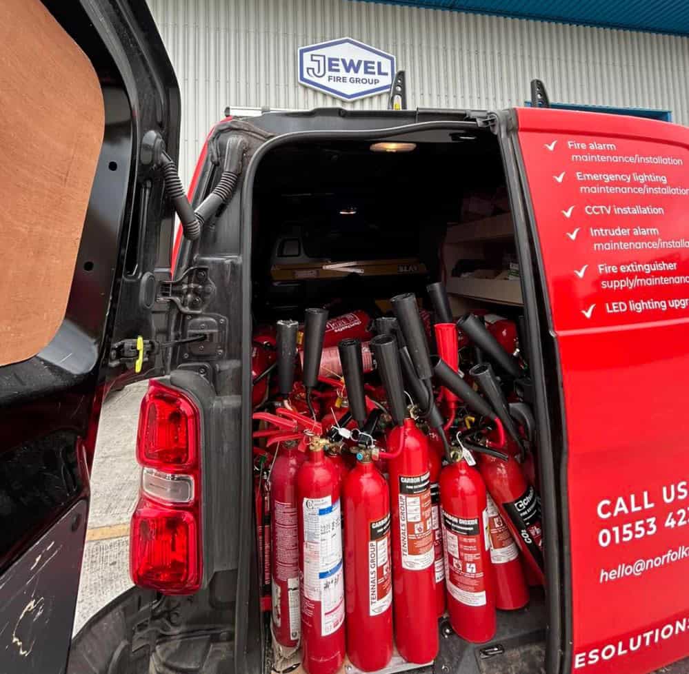 Fire extinguishers stacked in a service van