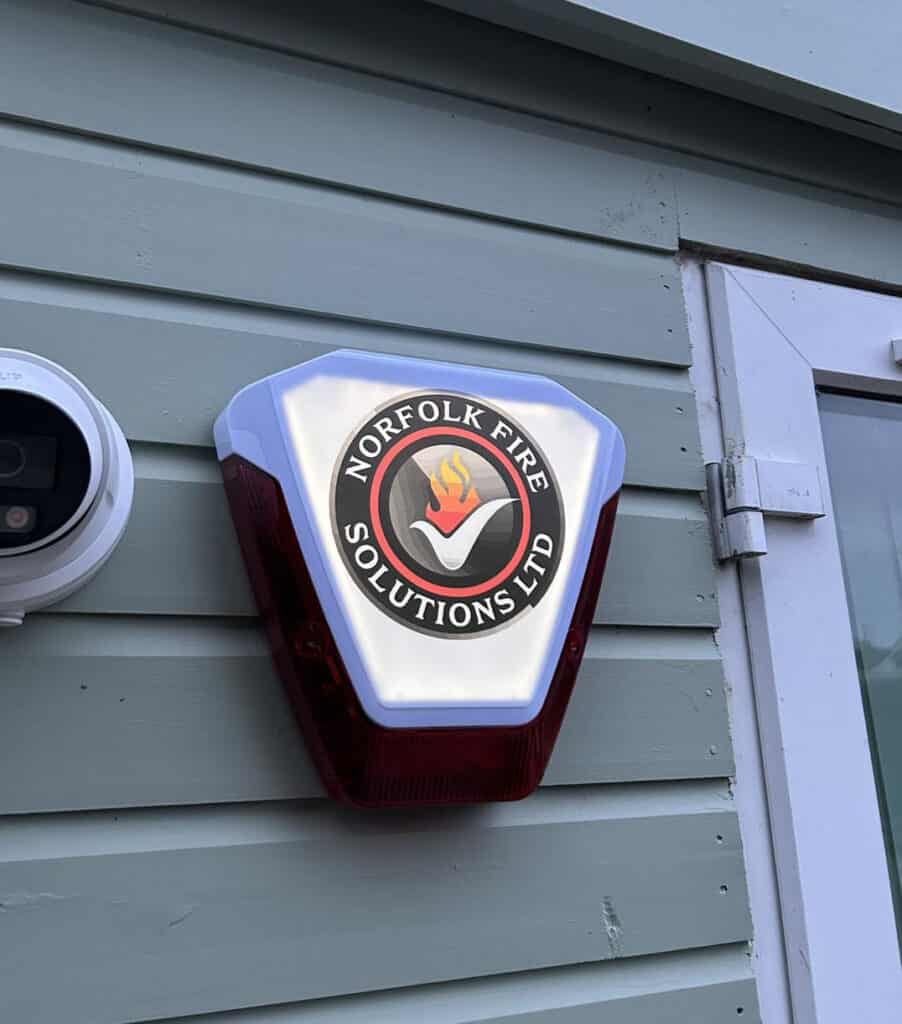 Installation of Norfolk Fire security alarm fixed on house wall
