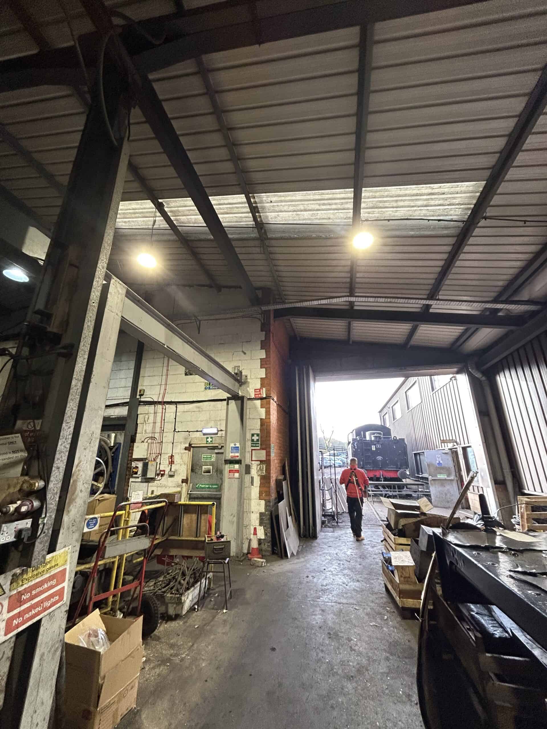 Industrial workshop with person walking outside