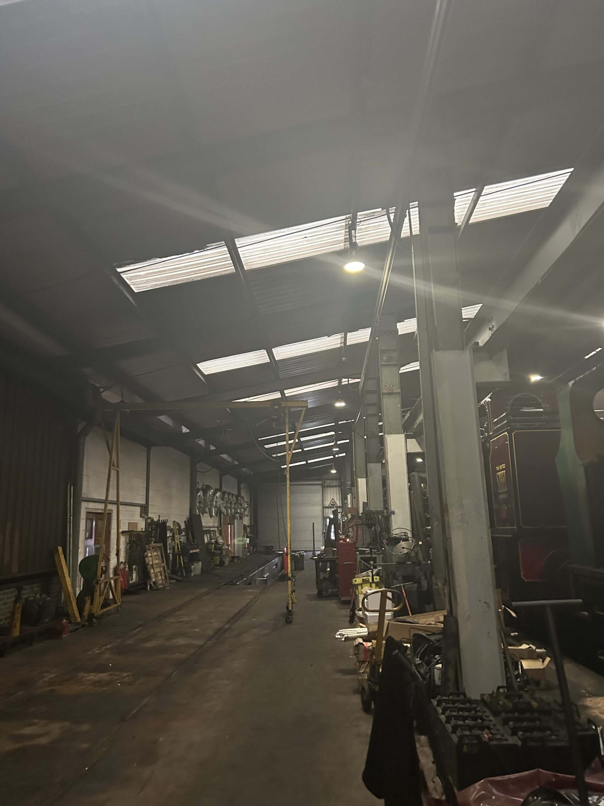 Interior of a workshop with tools and machinery.