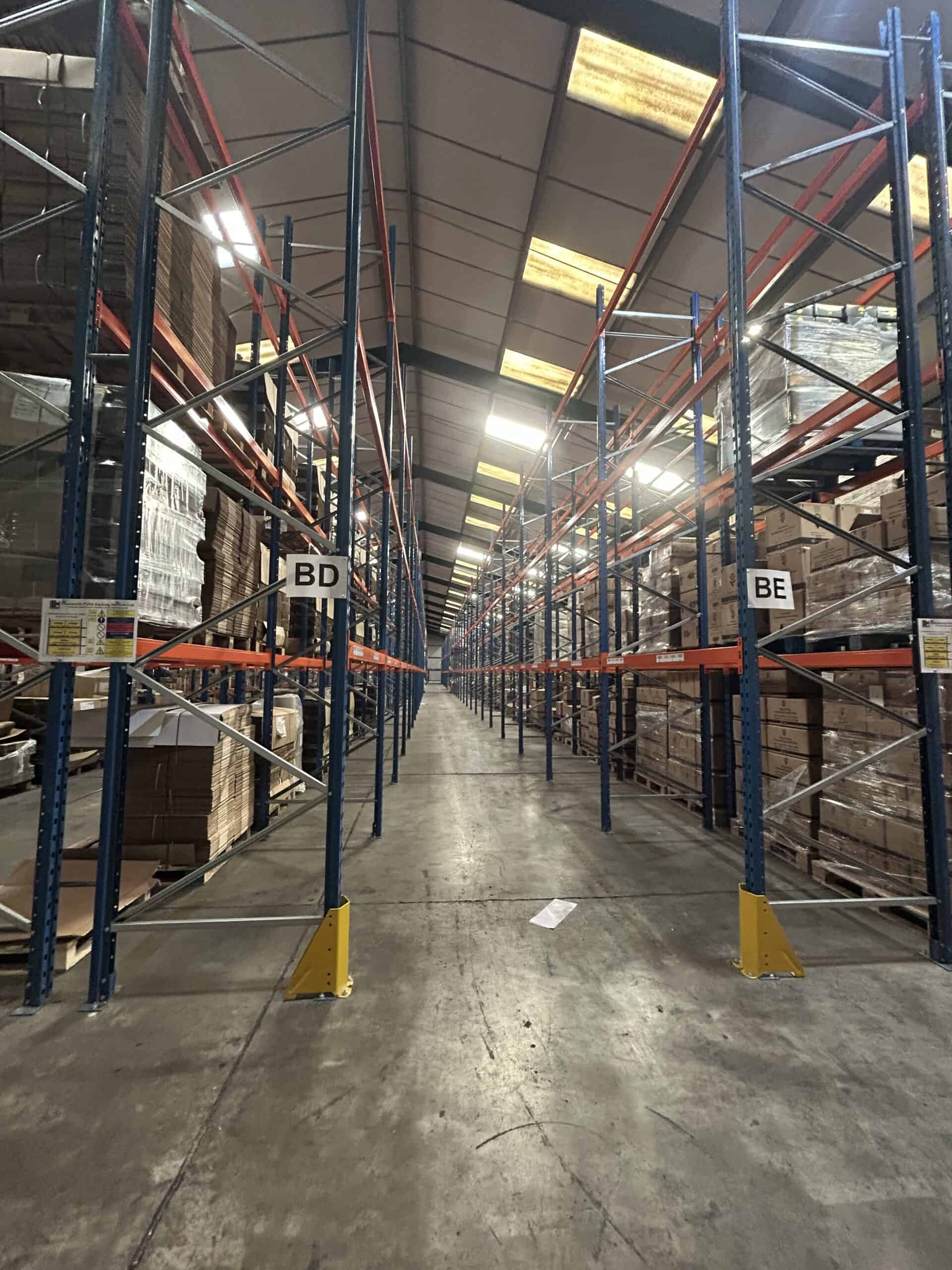 Interior of a warehouse with storage racks.