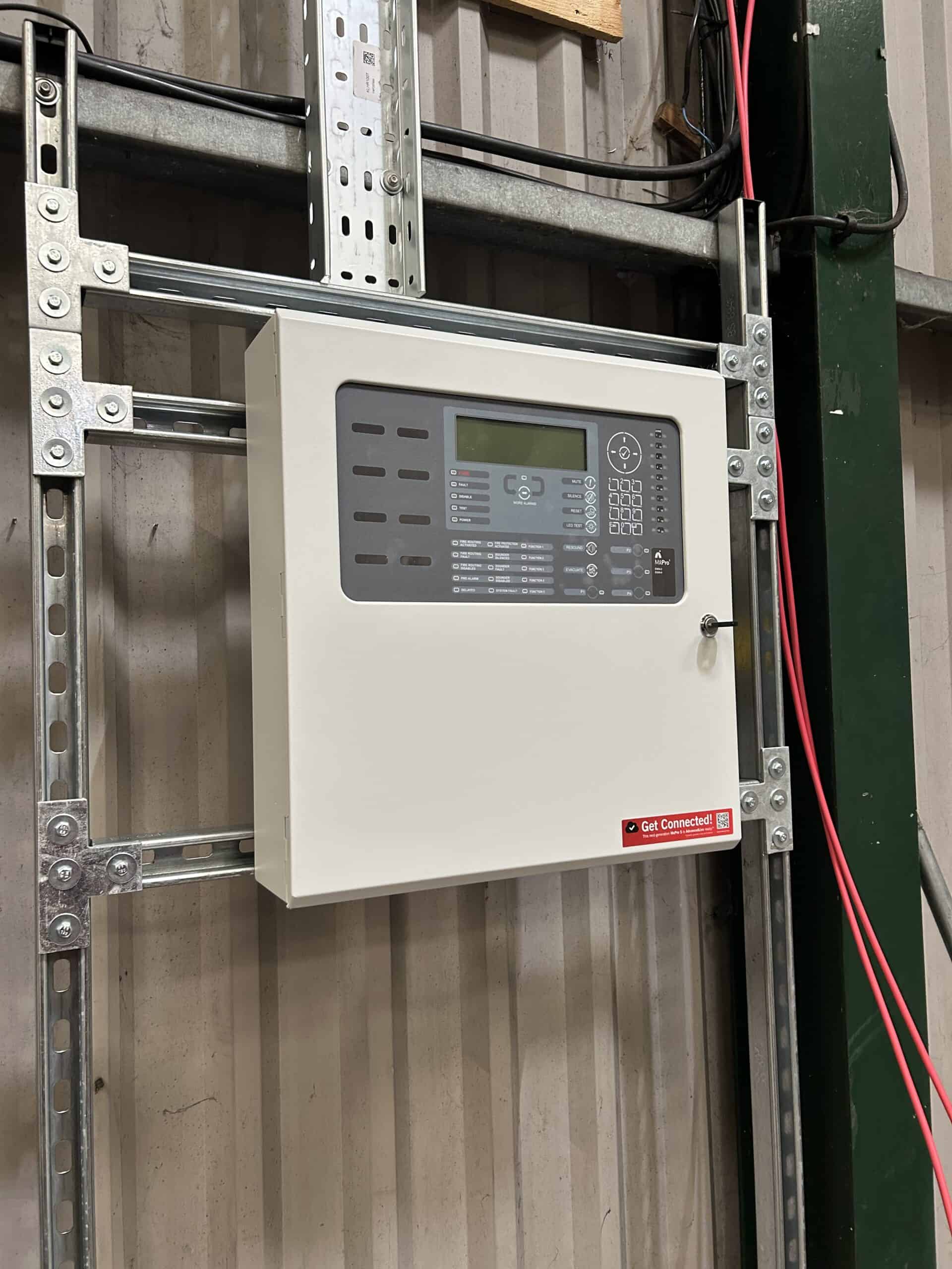 Fire alarm control panel mounted on wall