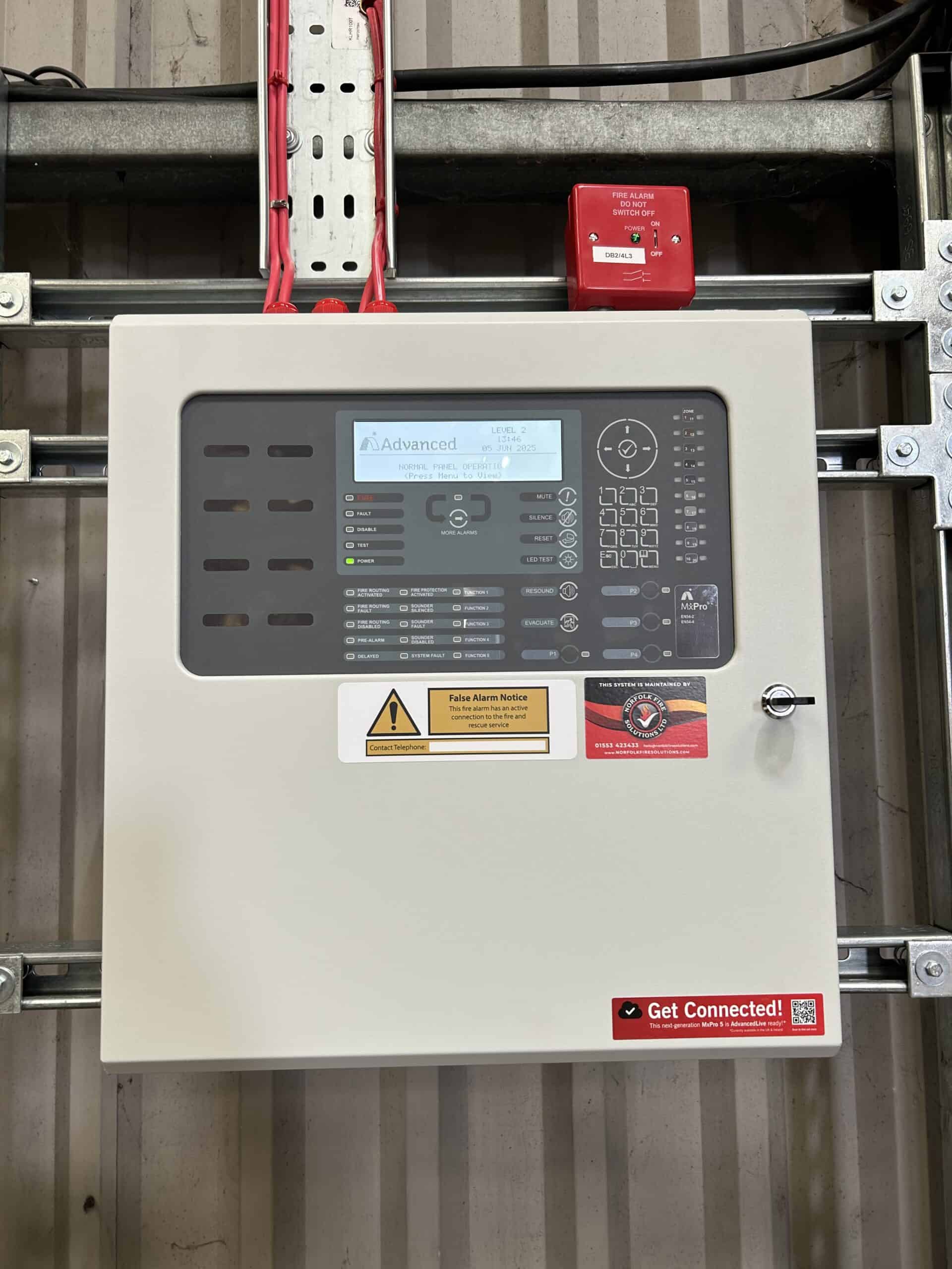 Fire alarm control panel with warning notices