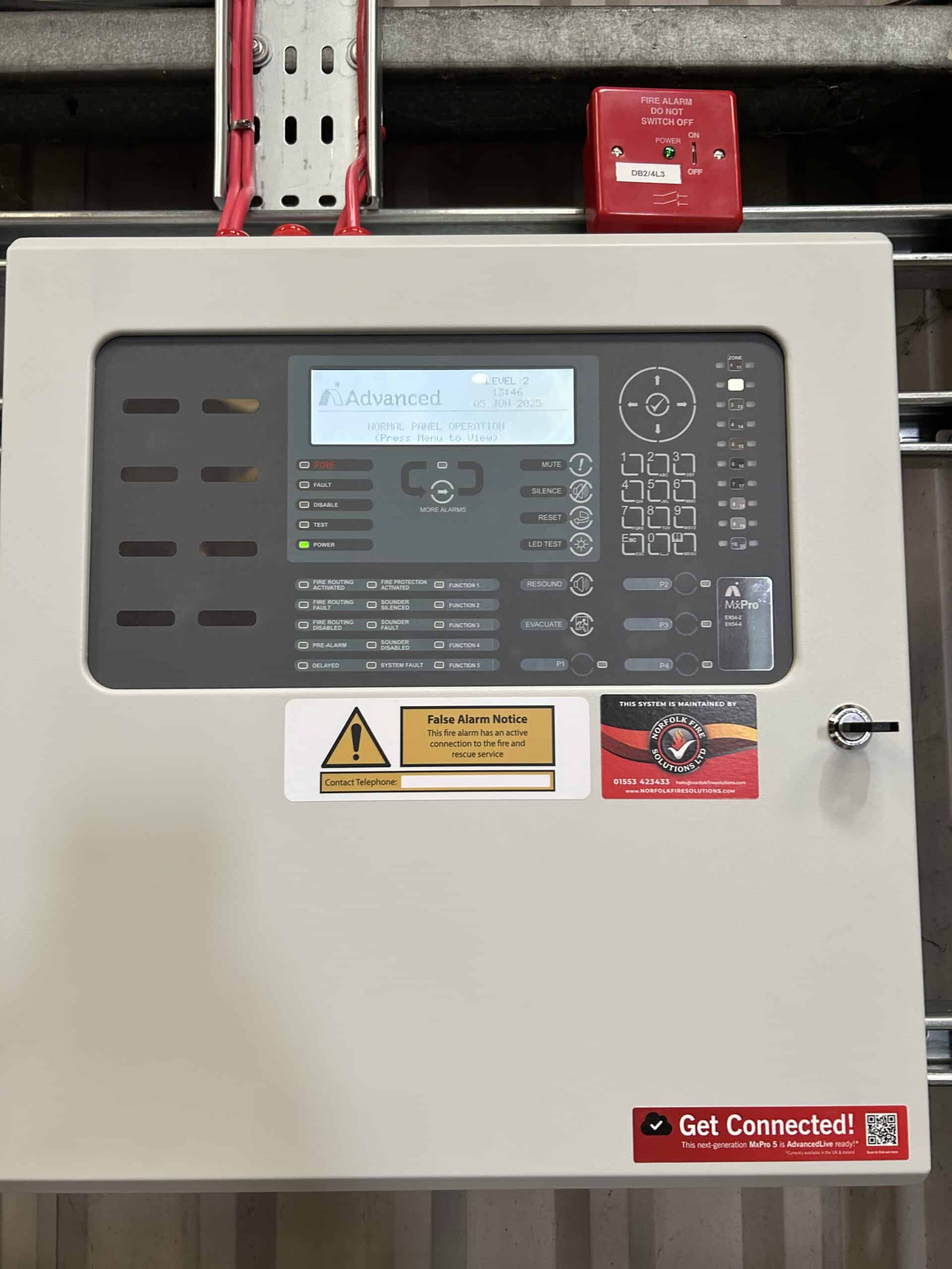 Fire alarm control panel displaying operational status.